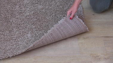 Systèmes de fixation pour tapis 